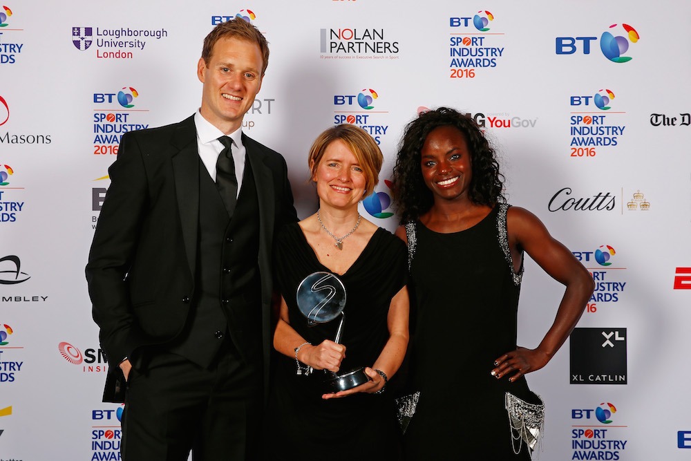 LONDON, ENGLAND - APRIL 28: Eniola Aluko and Dan Walker present the Leadership in Sport Award award in association with Nolan Partners to Kelly Simmons at the BT Sport Industry Awards 2016 at Battersea Evolution on April 28, 2016 in London, England. The BT Sport Industry Awards is the most prestigious commercial sports awards ceremony in Europe, where over 1750 of the industry's key decision-makers mix with high profile sporting celebrities for the most important networking occasion in the sport business calendar. (Photo by Christopher Lee/Getty Images for BT Sport Industry Awards) *** Local Caption *** Eniola Aluko; Dan Walker; Kelly Simmons